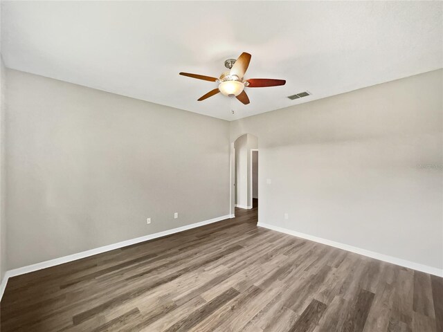 spare room featuring wood-type flooring and ceiling fan