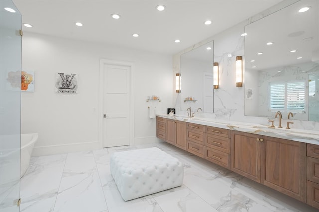 bathroom featuring vanity and a bath