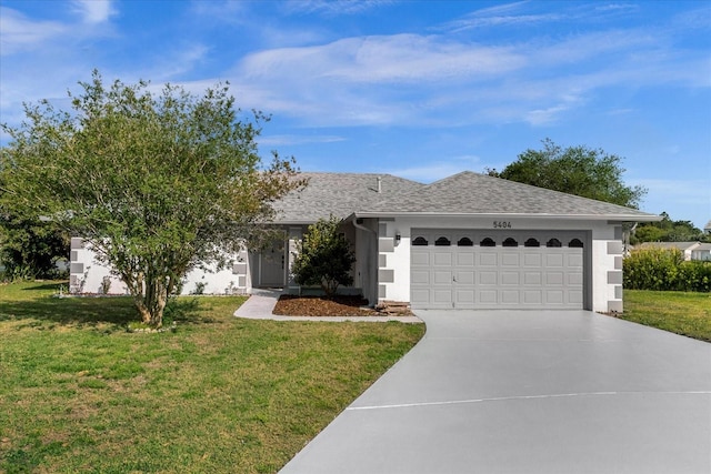 ranch-style home with a garage and a front yard