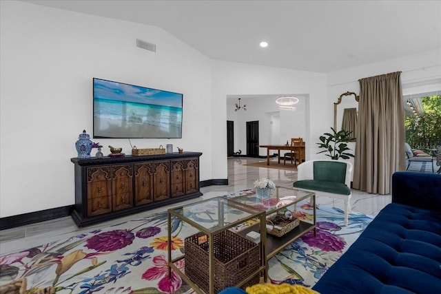 living room with vaulted ceiling and a chandelier