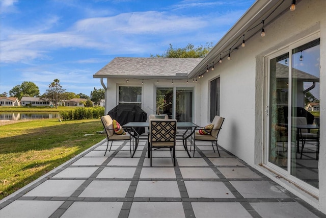 view of patio featuring a water view