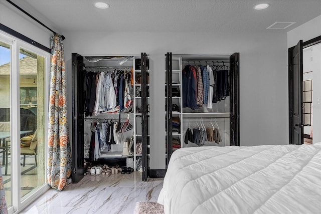 bedroom featuring access to outside and a textured ceiling