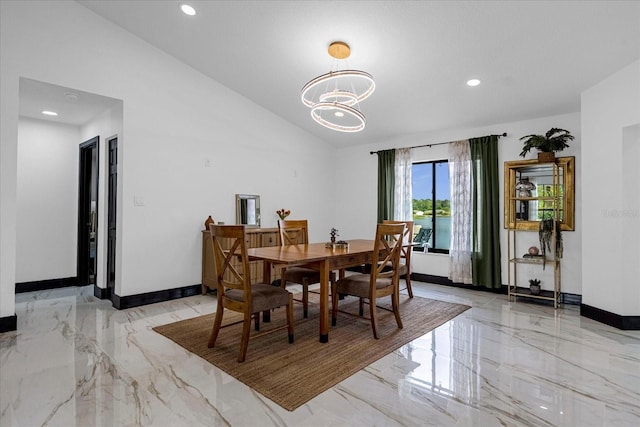 dining space featuring a notable chandelier