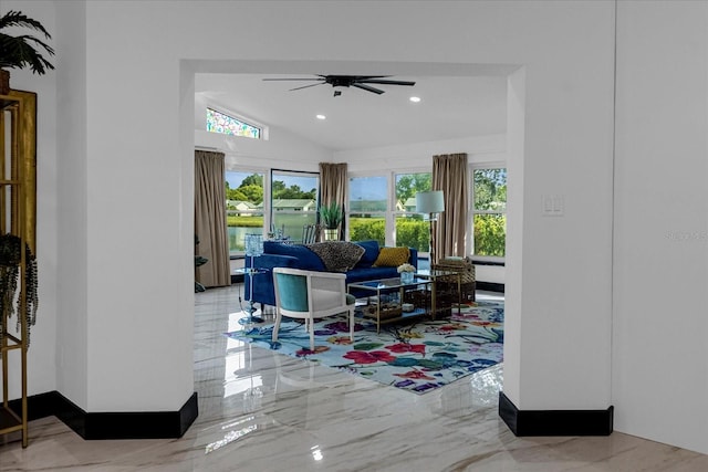 living room with vaulted ceiling and ceiling fan