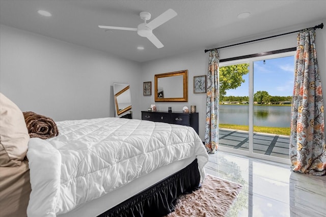 bedroom with ceiling fan, a water view, and access to outside