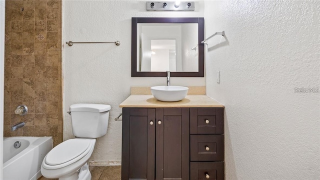 full bathroom featuring tiled shower / bath, vanity, toilet, and tile patterned floors