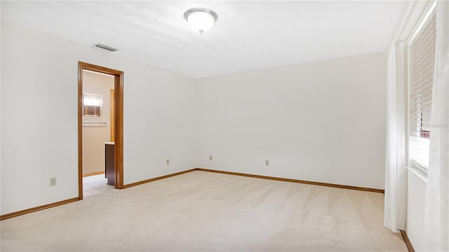 unfurnished bedroom featuring light colored carpet