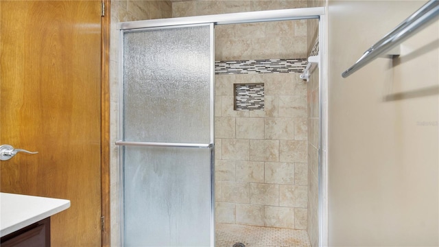 bathroom with vanity and an enclosed shower