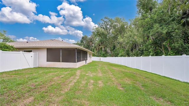 view of yard featuring a sunroom