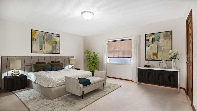 bedroom with light colored carpet