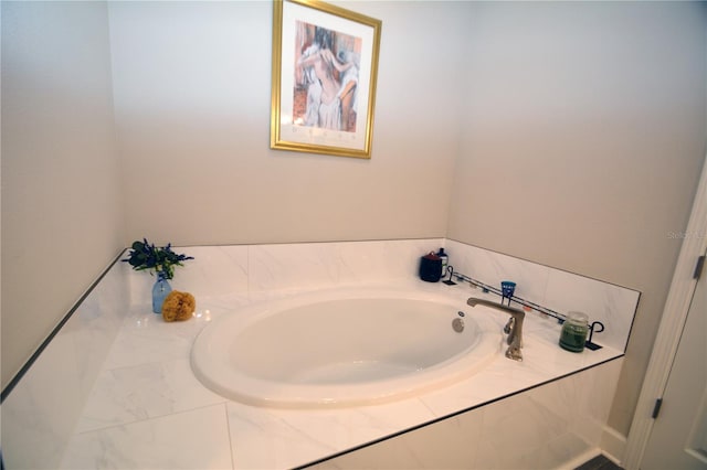 bathroom with tiled bath