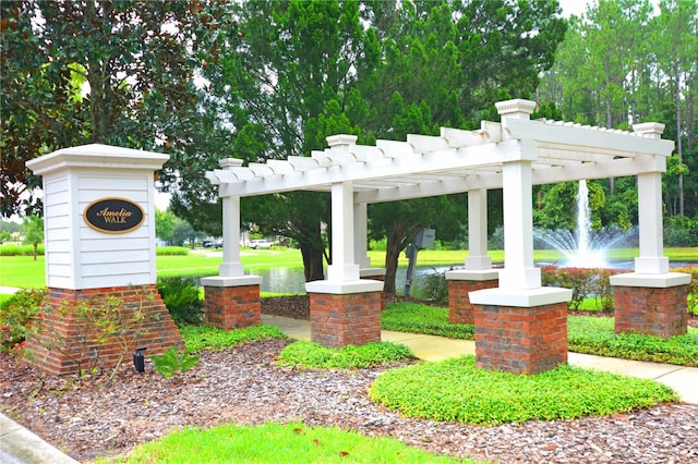 view of home's community featuring a pergola and a water view