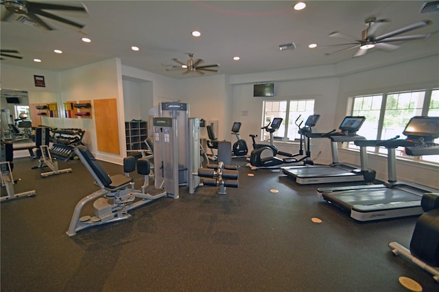 exercise room with ceiling fan