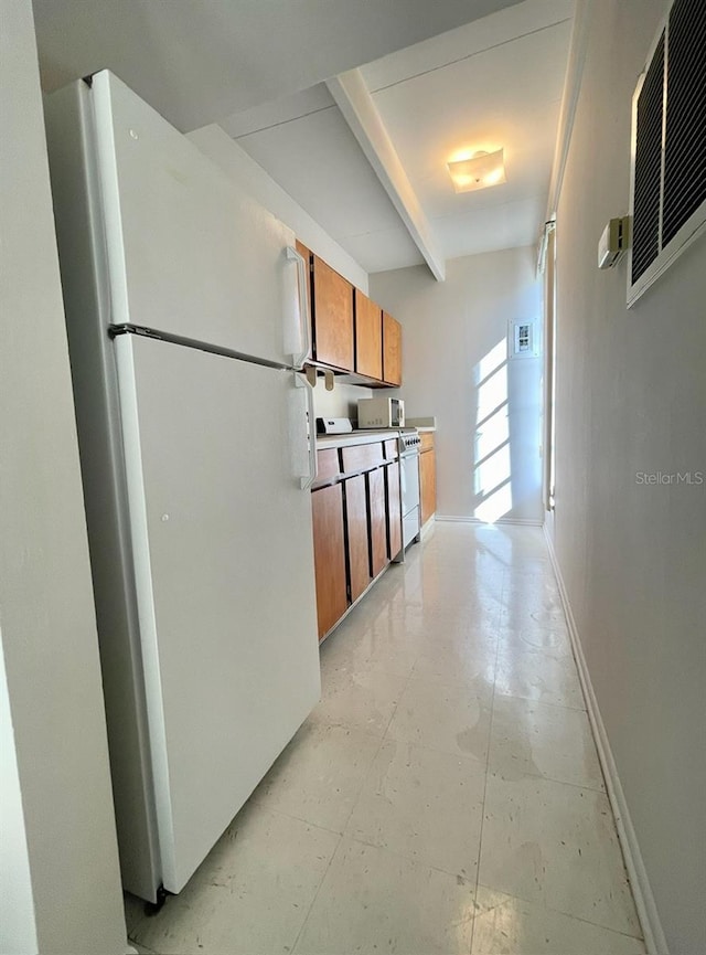 kitchen featuring dishwasher and white fridge