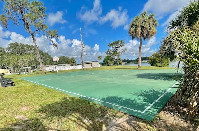 view of basketball court featuring a yard