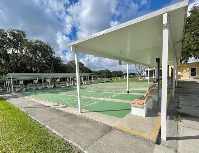 view of home's community featuring shuffleboard