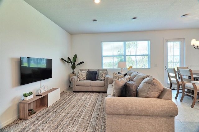 tiled living room with a textured ceiling