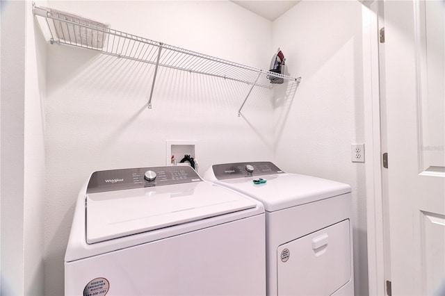 laundry area featuring washing machine and clothes dryer