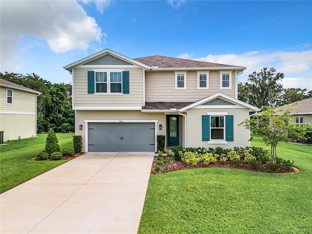 view of front of home with a front lawn and a garage