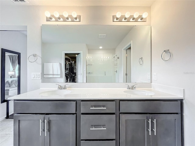 bathroom with vanity and tile patterned floors