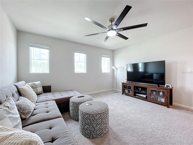 carpeted living room with a textured ceiling and ceiling fan