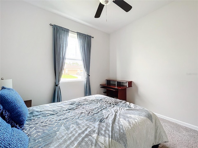 bedroom with ceiling fan and carpet floors