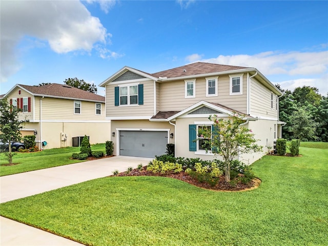 view of front of home with a garage and a front lawn