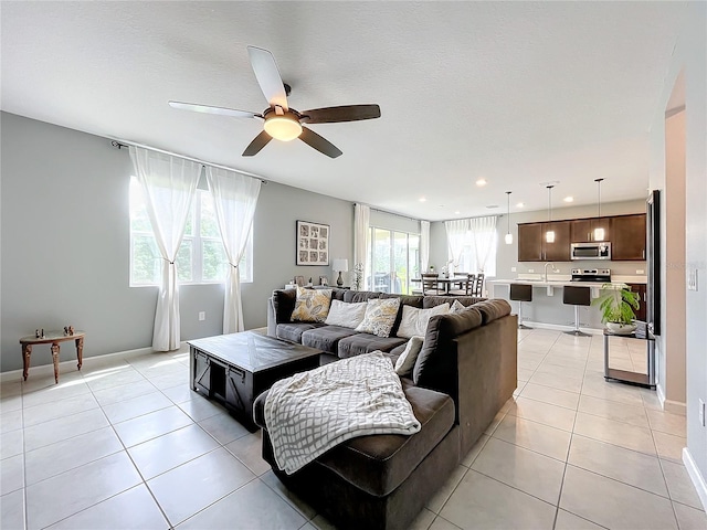 8060 Cherrystone St, Leesburg, FL 34748 - living area with a ceiling fan, light tile patterned floors, baseboards, and recessed lighting