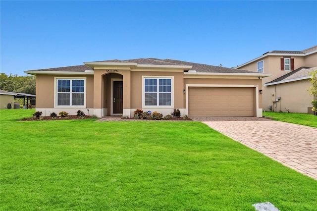 view of front facade with a garage and a front yard