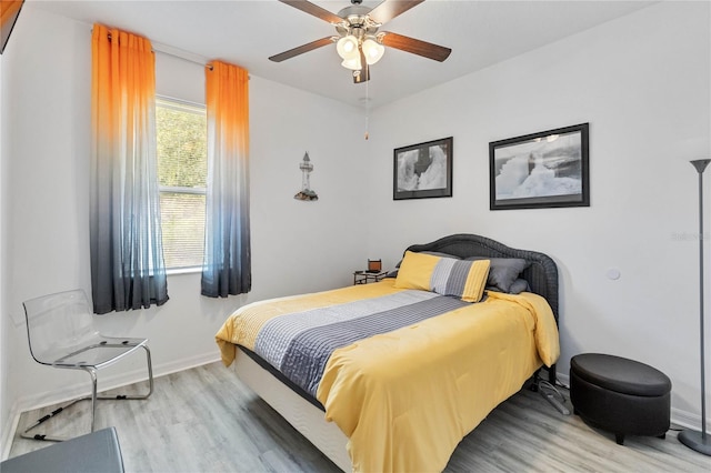 bedroom featuring ceiling fan and light wood-type flooring