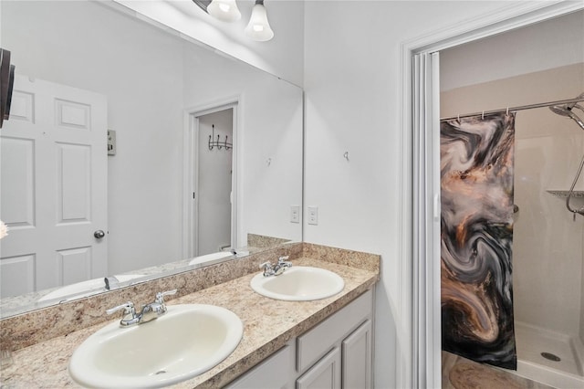 bathroom featuring vanity and a shower with shower curtain