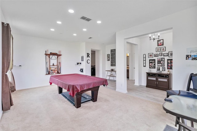 game room with pool table and light carpet