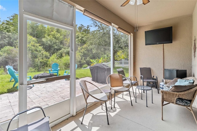 sunroom / solarium with ceiling fan