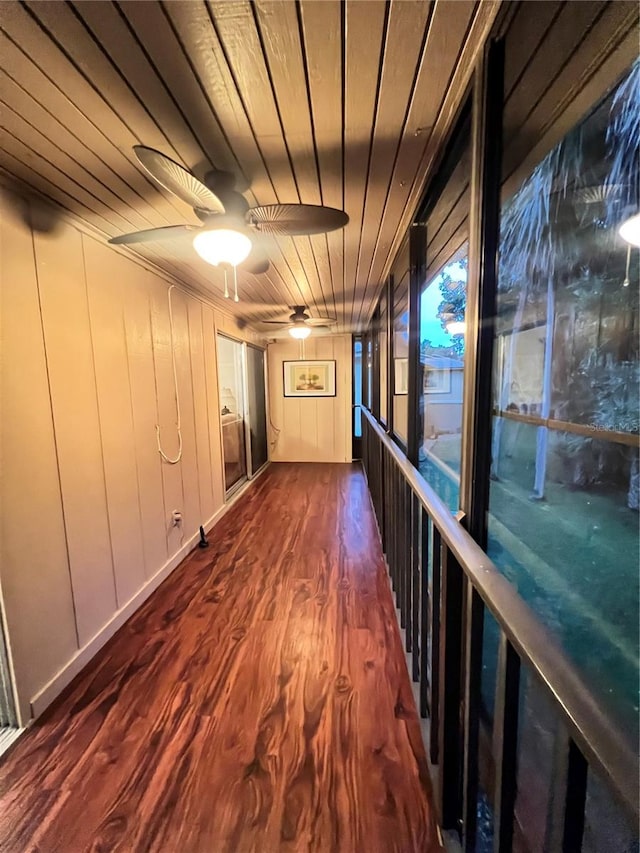 hall with wood ceiling and dark wood-type flooring