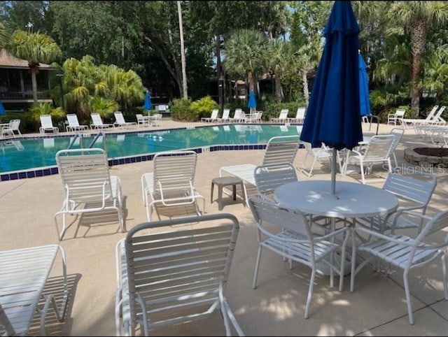 view of swimming pool featuring a patio