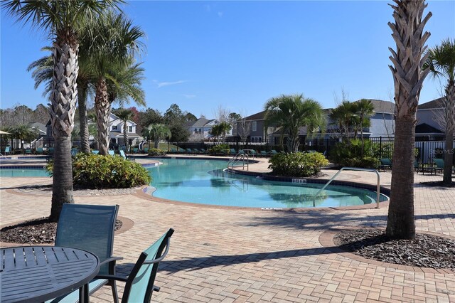 view of swimming pool with a patio area