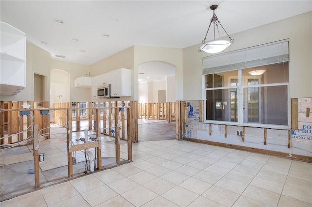 unfurnished room with light tile patterned floors