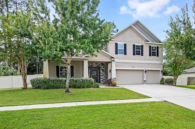 craftsman-style house featuring a front yard and a garage