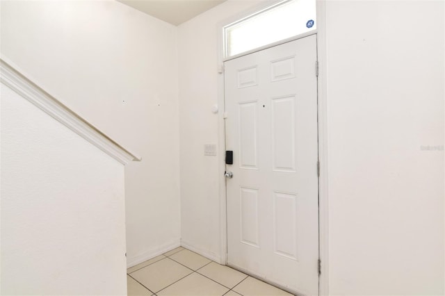 entrance foyer with light tile patterned flooring