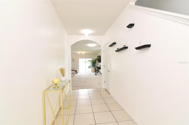 hall featuring light tile patterned flooring