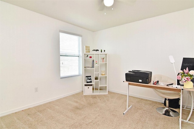 home office featuring light carpet and ceiling fan