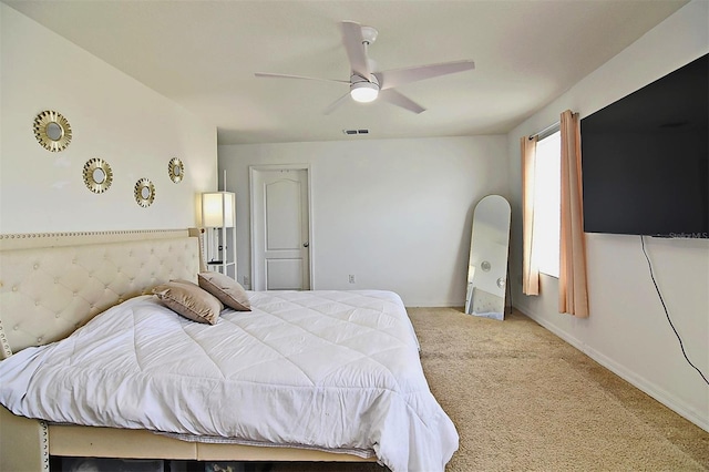 bedroom featuring ceiling fan and light carpet