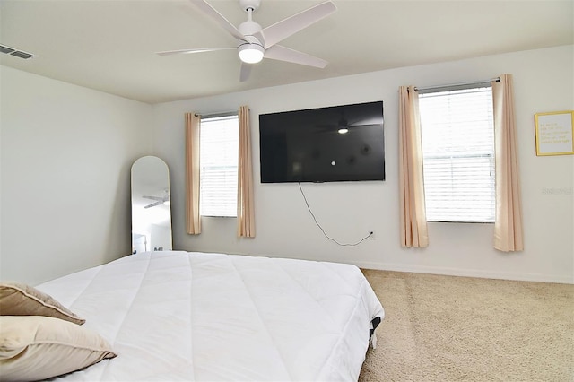 carpeted bedroom with ceiling fan