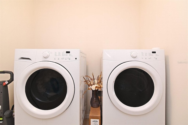 clothes washing area featuring washing machine and clothes dryer