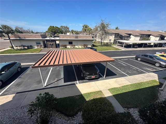 view of parking / parking lot with a carport