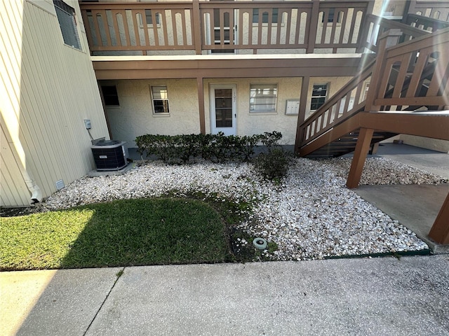 view of yard featuring a balcony and central AC