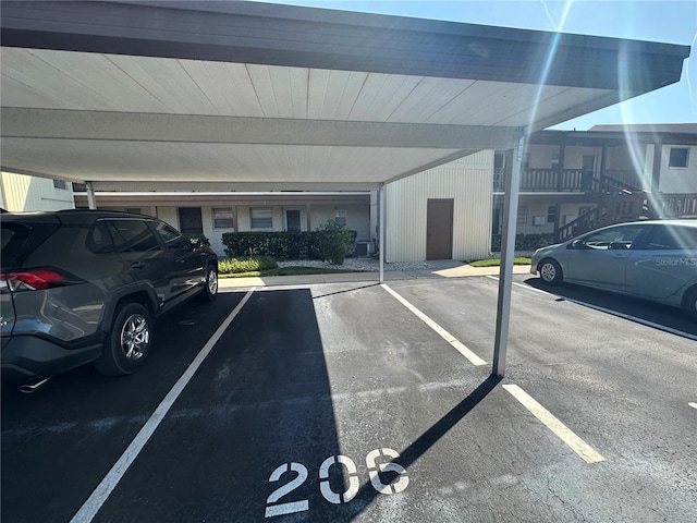 view of vehicle parking featuring a carport