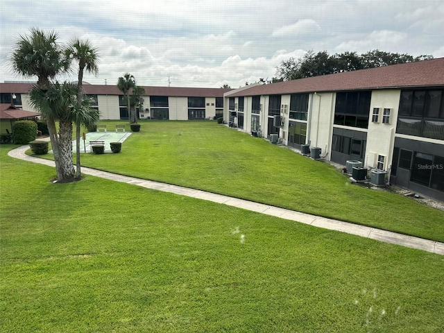 view of property's community featuring a yard