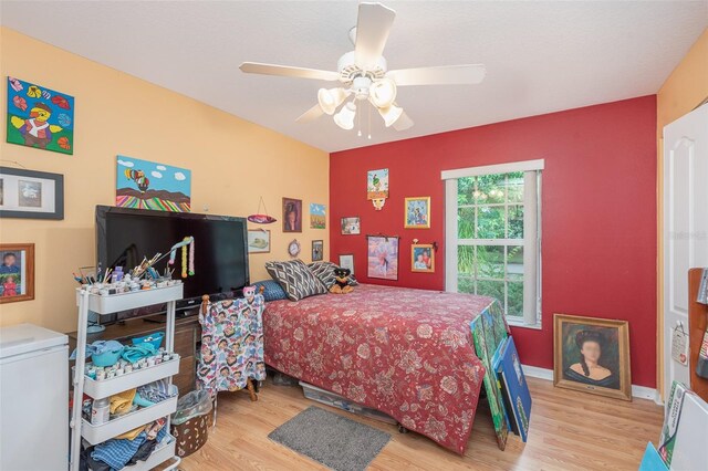 715 Unabelle Ave, Daytona Beach, FL 32117 - bedroom with light hardwood / wood-style floors and ceiling fan