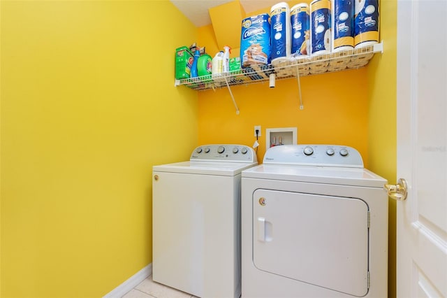 715 Unabelle Ave, Daytona Beach, FL 32117 - washroom with light tile patterned flooring and washing machine and clothes dryer